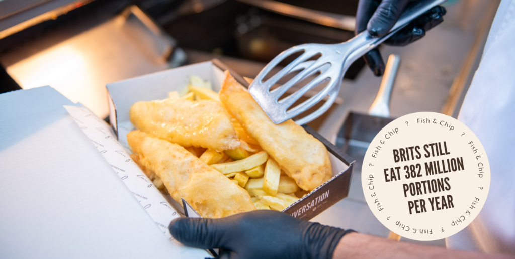 Delicious battered fish and chips at Zan Fish being portioned into container, badge on the image says: Brits still eat 383 million portions per year